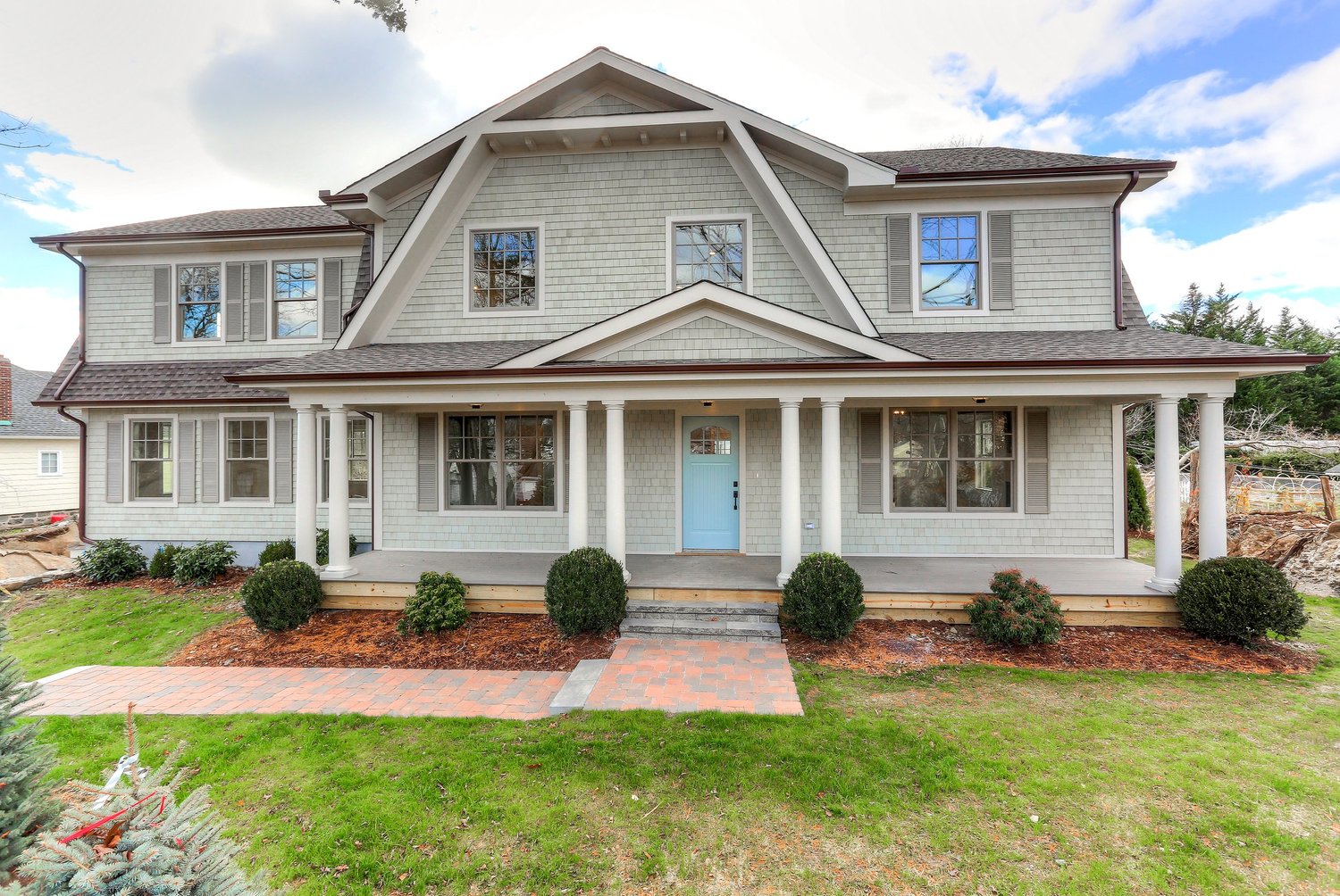 Custom home framing on a wooded lot in a Charlotte-area neighborhood